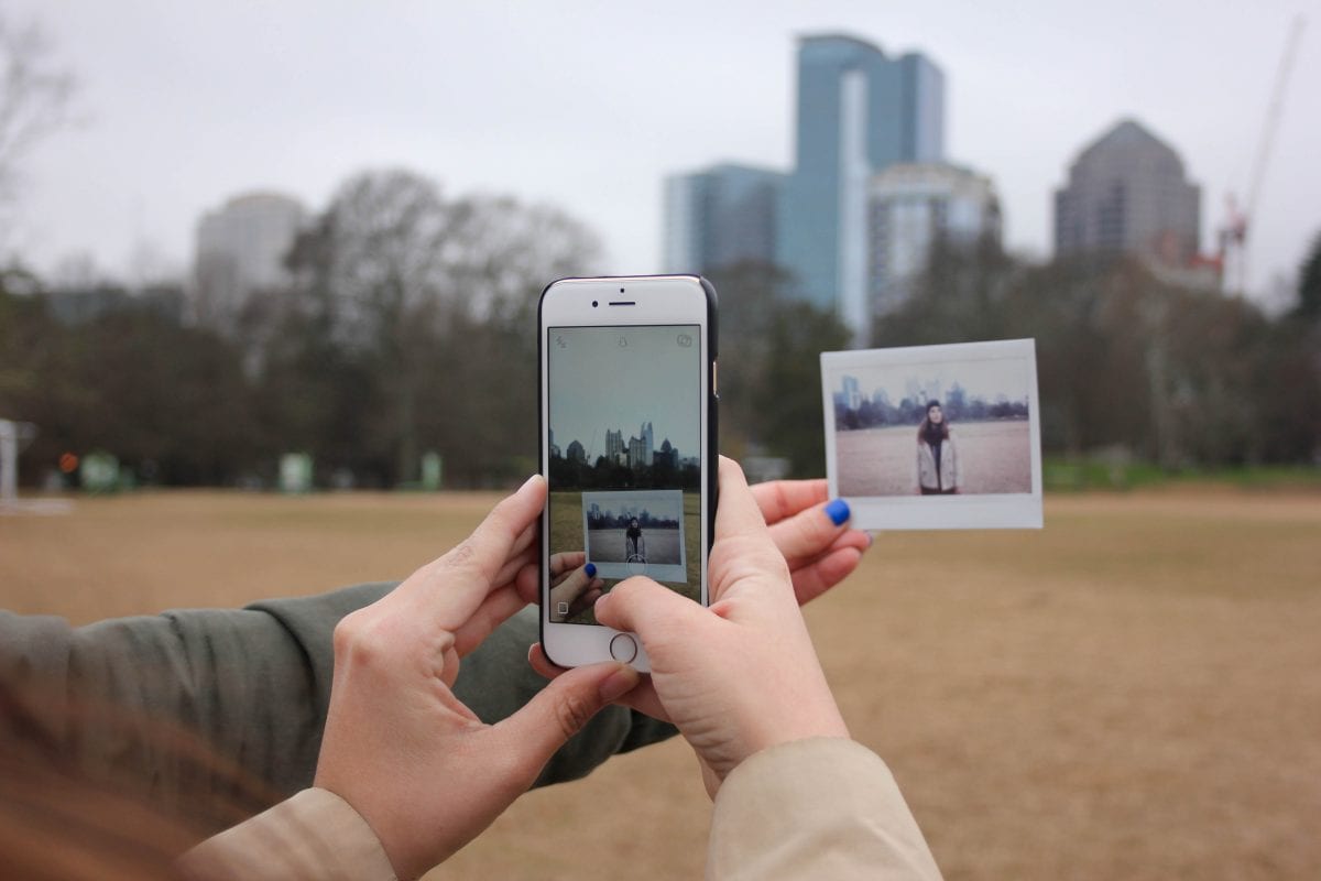 Person taking a photo of a photo