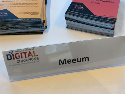 Meeum name tag on a desk